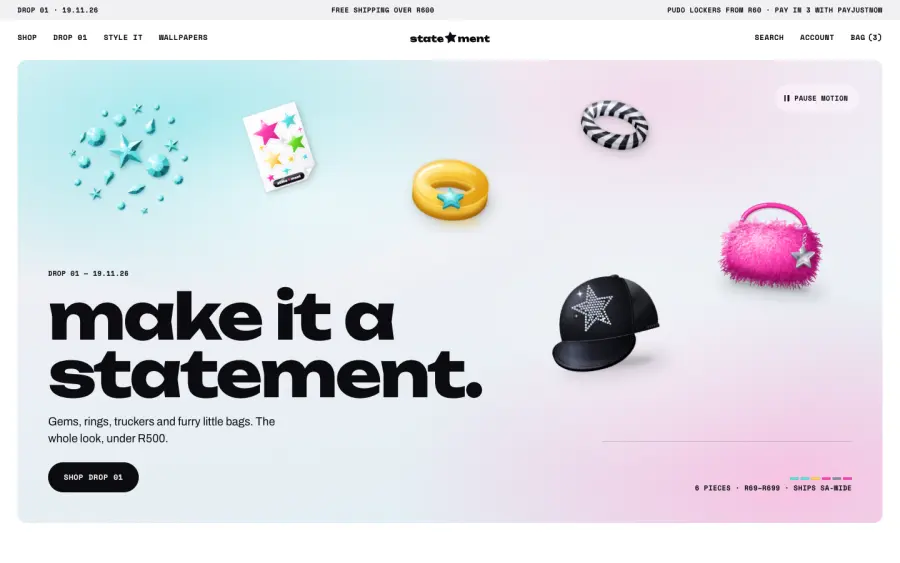 Statement homepage on desktop: make it a statement, with gems, a ring, a trucker cap and a furry bag floating on a soft gradient.